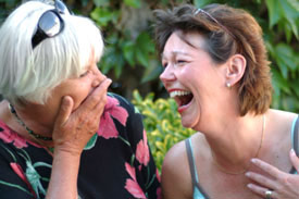 2 women laughing together